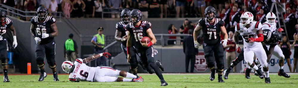 Redshirt sophmore quarterback Bailey Hockman rushes during the game versus Ball State on Saturday, Sep.21, 2019 at Carter-Finley Stadium. Hockman had two completions on three attempts at the game the Wolfpack won 34-23.