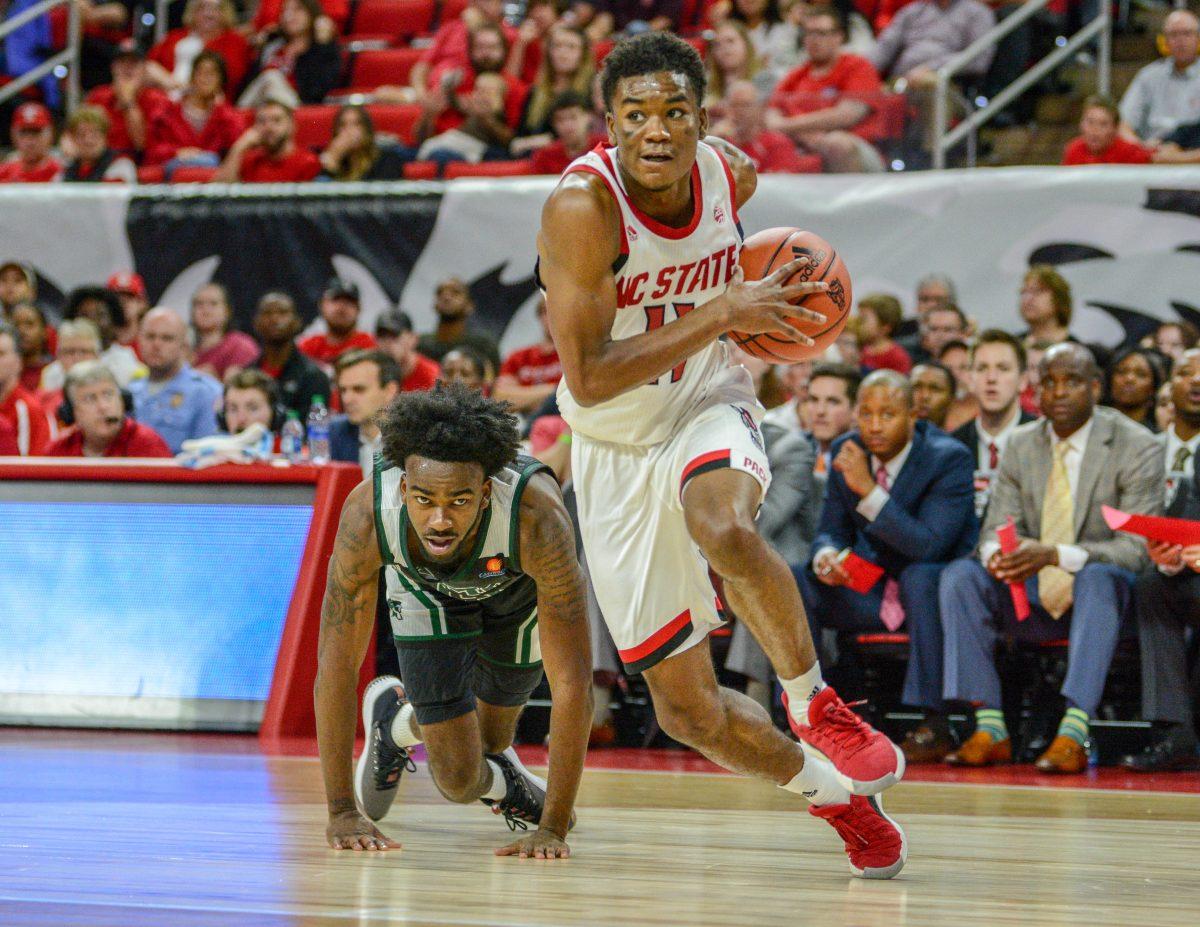 Senior guard Markell Johnson pushes past the Mount Olive defense on Sunday, Oct. 27, 2019 in PNC Arena. Johnson scored 26 points against the Trojans. NC State beat Mount Olive 113-73.