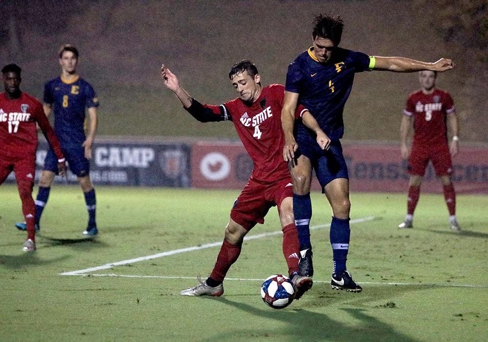 Junior defender David Norris battles for the ball with an East Tennessee State University opponent on Tuesday, Oct. 8 2019 at Dail Soccer Stadium. NC State won with a final score of 1-0.