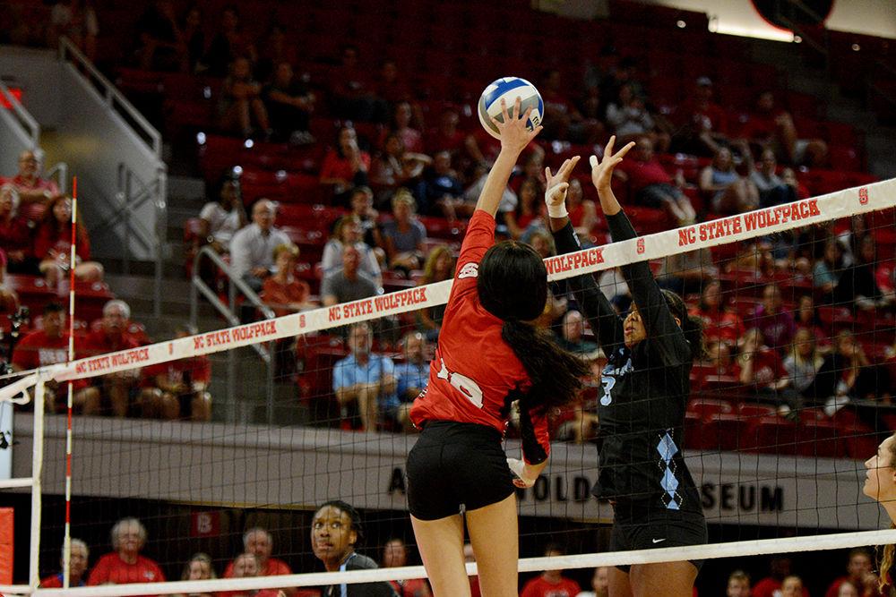 Redshirt freshman setter, Nina Sharpton dumps the ball over the net against UNC on Oct. 2, 2019 in Reynolds Coliseum. Sharpton played in five sets and had one kill, 50 assists, and 11 digs in the 2-3 loss against UNC.
