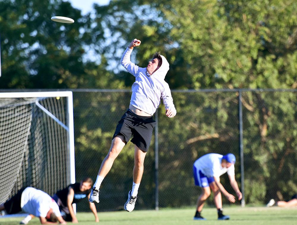 Senior captain Austin von Alten jumps for the frisbee at ultimate frisbee practice on Tuesday, September 24, 2019 at Method Community Park.