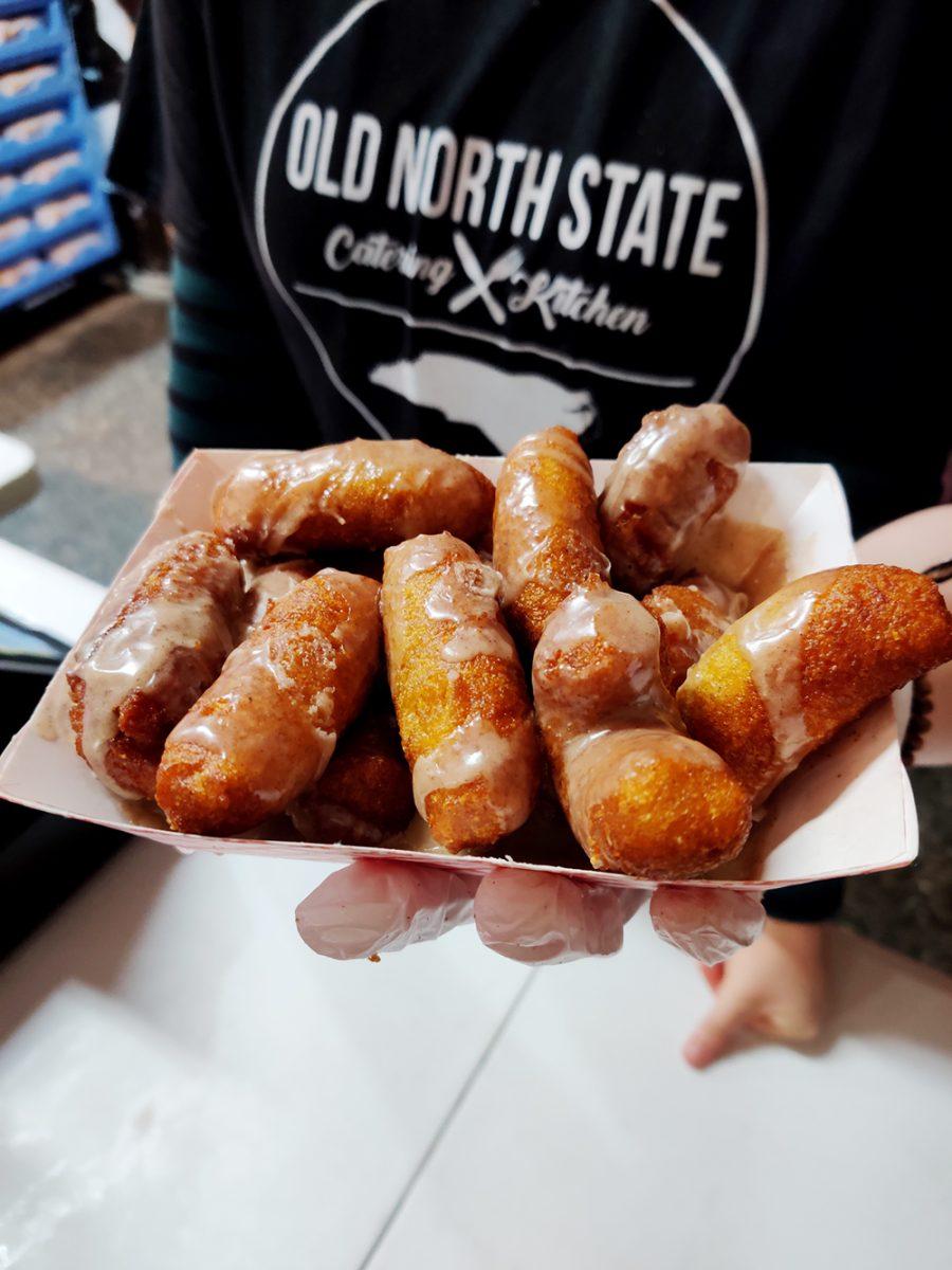Pumpkin spice hushpuppies with a pumpkin spice glaze are a new food featured at the NC State Fair this year. The State Fair features different foods, rides, and attractions.