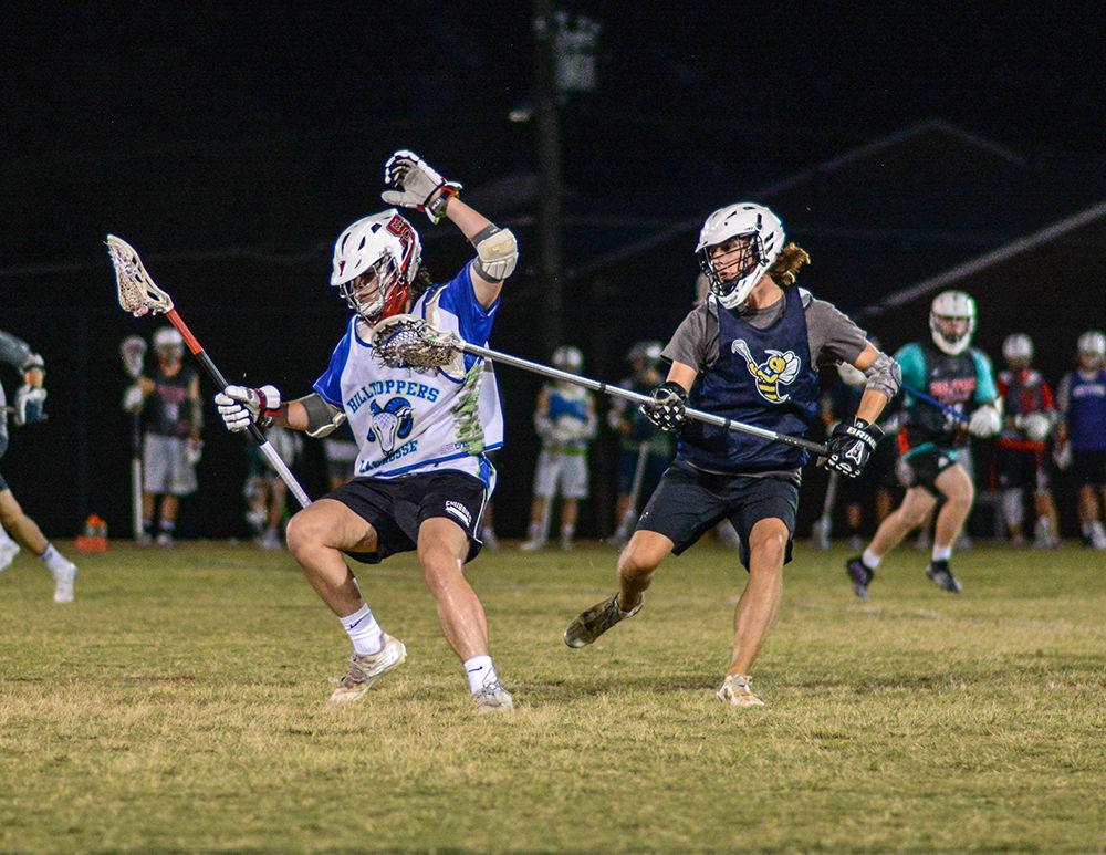 First years Jackson Webb and Will Beauchamp scrimmage during their Fall-ball practice at the Method Road Fields on Monday, Sept. 30, 2019. Coached by Chris Demarest, the PackLAX team plays in the Southeastern Lacrosse Conference (SELC) against teams like UNC, Clemson, and ECU.