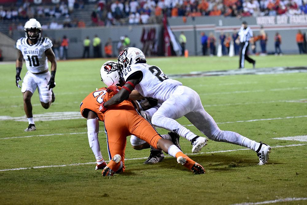 Senior cornerback Kishawn Miller tackles a Syracuse player on Thursday, Oct. 10, 2019 in Carter-Finley Stadium. Miller totaled seven tackles in the 16-10 win over the Orange.