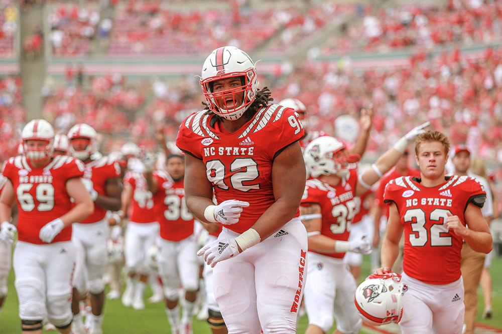 Redshirt junior defensive end Larrell Murchison celebrates the 21-3 lead while heading back to the locker room at the end of the first half. NC State would go on to win 28-23 over Boston College on Saturday, Oct. 6 in Carter-Finley Stadium.