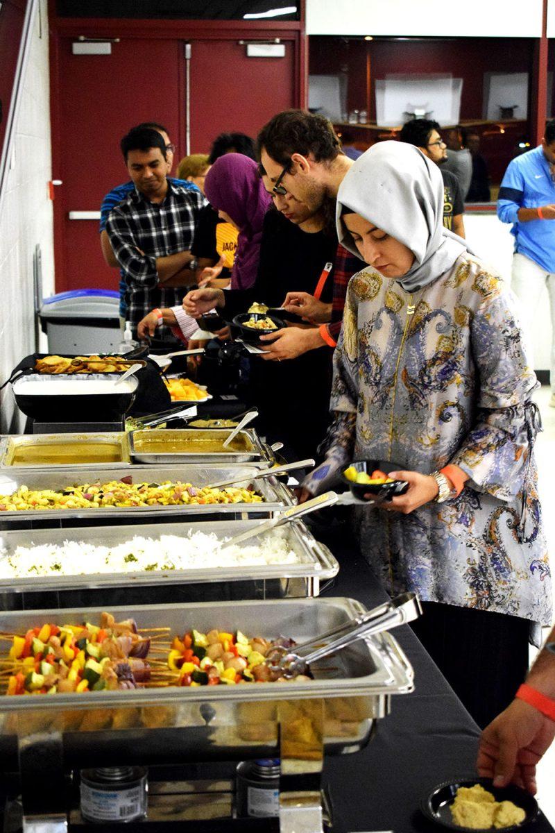 Attendees eat cultural dishes including baklava and hummus during the Turkish Movie and Dance night in Witherspoon Student on October 5, 2019. The event was organised by the Turkish Student Association and screened the turkish movie "The Wild Pear Tree", followed by food and DJ.