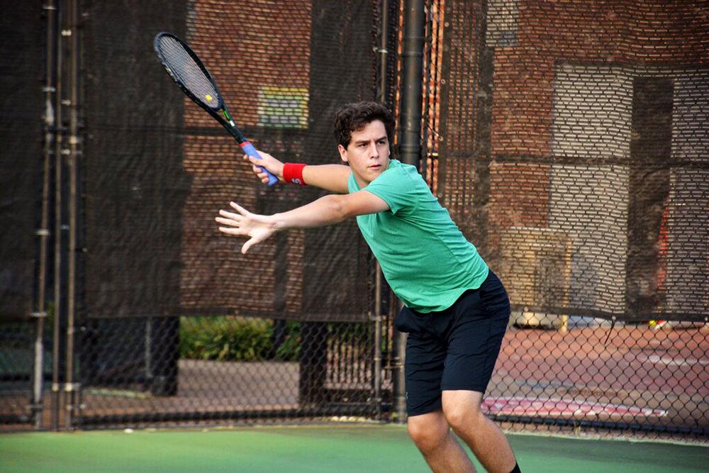 Liam Martin, a first year majoring in engineering, prepares to return a volley at club tennis practice on Monday, Sept. 30, 2019 at Carmichael Gym.