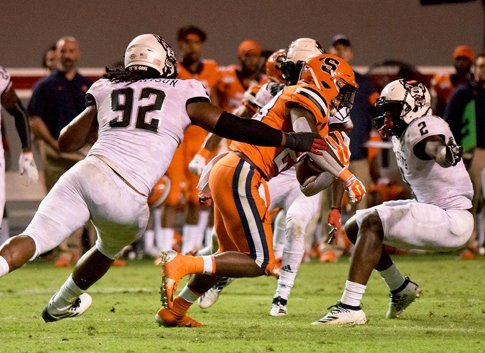 Graduate defensive tackle Larrell Murchison and junior linebacker Louis Acceus combined for a tackle against Syracuse on Thursday, Oct. 10, 2019 in Carter-Finley Stadium. Murchison totaled 6 tackles and Acceus totaled 14 tackles in the 16-10 win over the Orange.