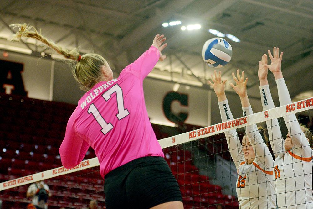 Redshirt junior middle blocker and right side, Jessica Kemp spikes the ball in Reynolds Coliseum on October 27. Kemp had ten kills in the Wolfpack&#8217;s 3-0 loss to Syracuse.