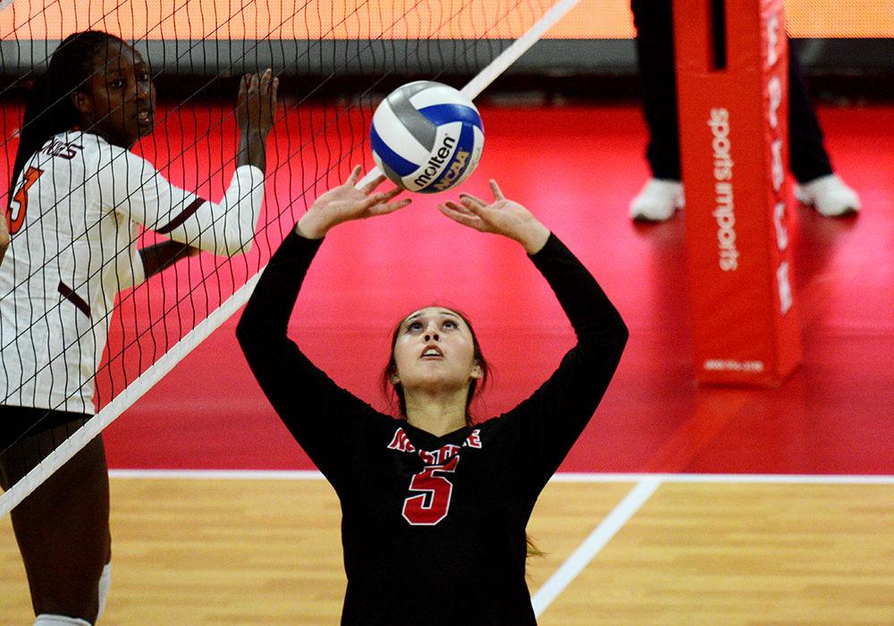 Freshman setter Kristen McDaniel sets the ball against Virginia Tech on October 4 in Reynolds Coliseum. McDaniel played in four sets with 19 assists and eight digs in the 3-2 win over Virginia Tech.