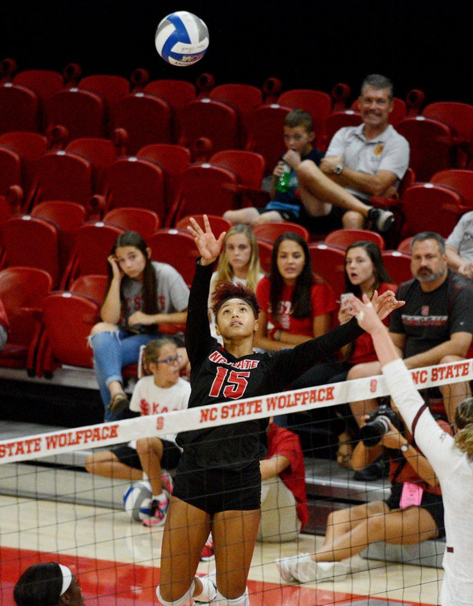 Sophomore opposite hitter Jade Parchment tips the ball against Virginia Tech on October 4 in Reynolds Coliseum. Parchment played in five sets with 15 kills, one ace, one assist, 15 digs, and two blocks in the 3-2 win over Virginia Tech.