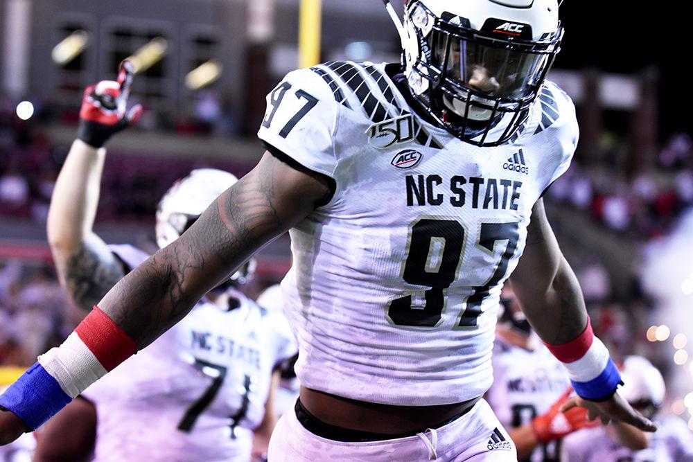 Redshirt sophomore defensive end Xavier Lyas runs out of the tunnel before the game against Syracuse on Thursday, Oct. 10, 2019 in Carter-Finley Stadium. Lyas totaled two tackles in the 16-10 win over the Orange.