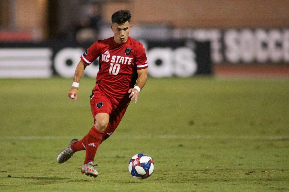 Junior midfielder David Loera brings the ball upfield during the 3-1 loss to No. 6 Wake Forest on Friday, Oct. 11, 2019 in Dail Soccer Stadium.