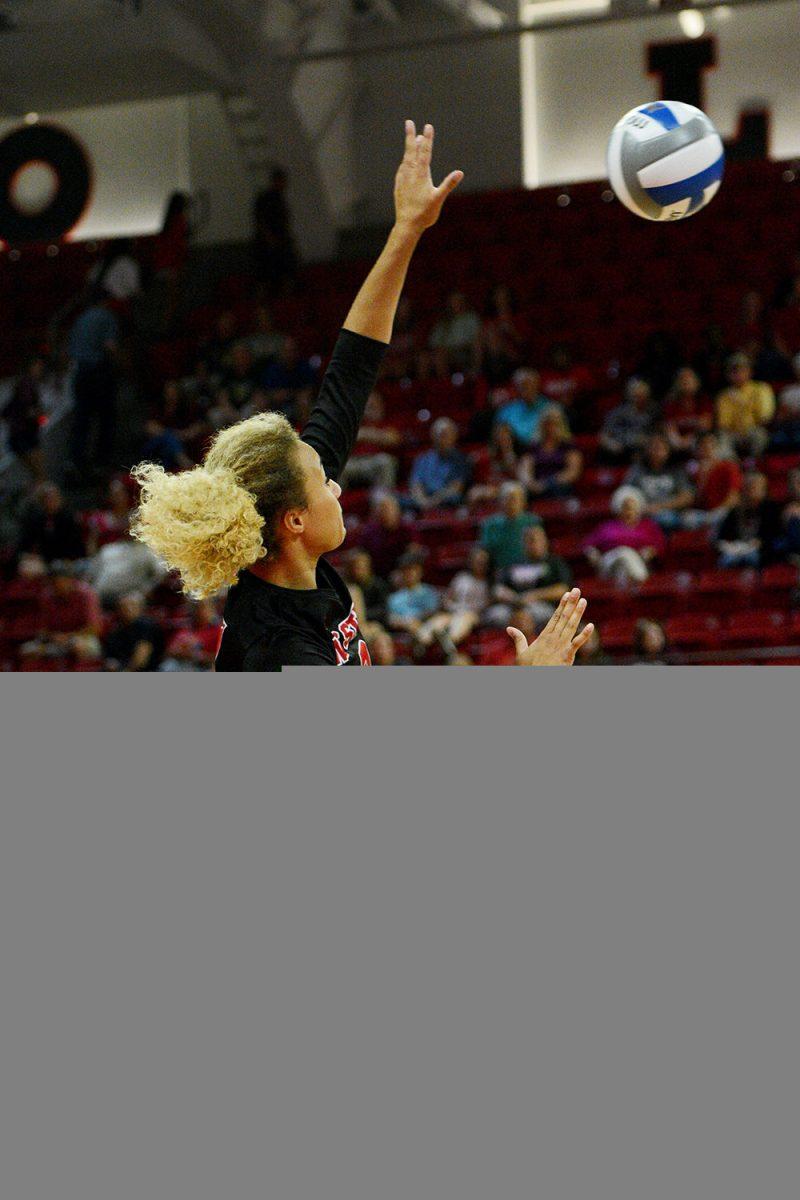 Junior opposite hitter Melissa Evans spikes the ball against Virginia Tech on October 4 in Reynolds Coliseum. Evans played in five sets and had 20 kills and one dig in the 3-2 win over Virginia Tech.