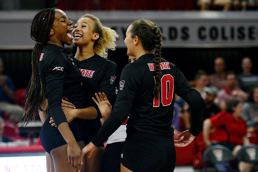 Sophomore middle blocker Pam Chukwujekwu celebrates with her teammates after a successful kill against Virginia Tech on October 4 in Reynolds Coliseum. Chukwujekwu played in five sets and had nine kills, seven blocks and one dig in the 3-2 win over Virginia Tech.