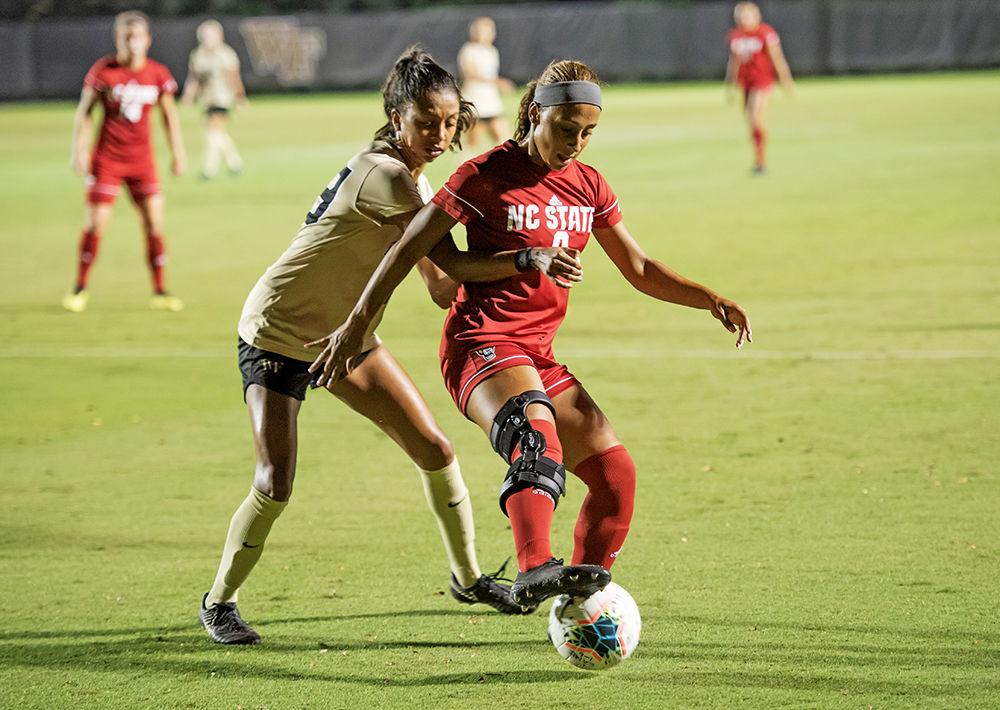 Senior forward Maxine Blackwood protecting the ball against a Wake Forest defender during the match on Sunday, Sept. 29, 2019 at W. Dennie Spry Soccer Stadium. Wake Forest and NC State tied 1-1.