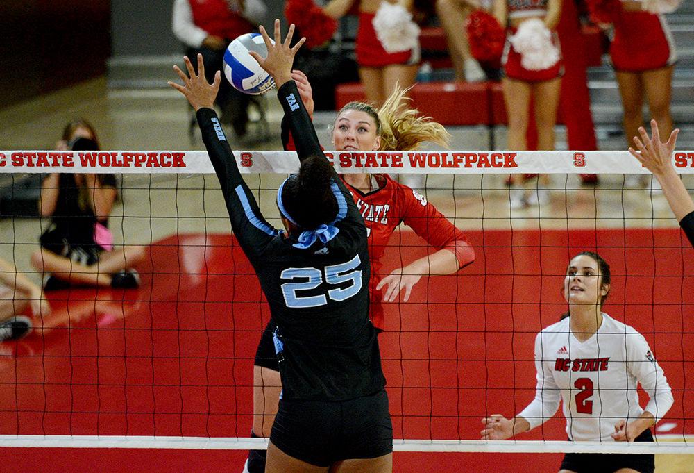 Redshirt junior middle blocker and right side, Jessica Kemp spikes the ball against UNC on Oct. 2, 2019 in Reynolds Coliseum. Kemp played in five sets and had 14 kills and one block in the 2-3 loss to UNC.