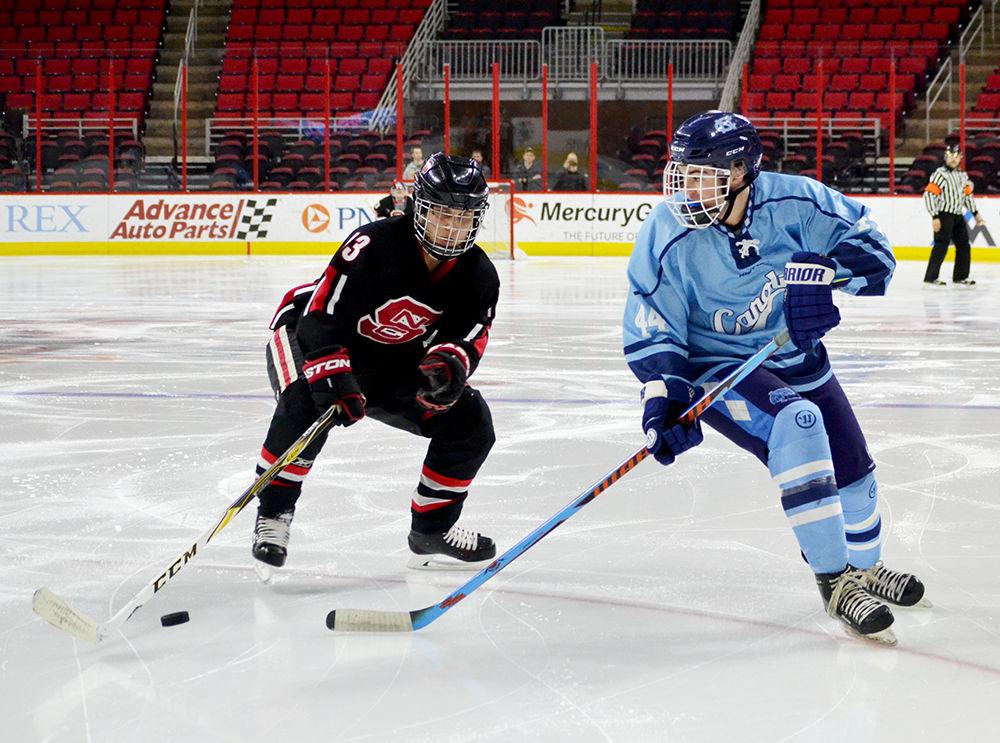 Ryan Lenzmeier, a graduate student majoring in history, handles the puck during the club hockey game against UNC-Chapel Hill on Monday, Jan 29, 2018 in PNC Arena. The Wolfpack beat the Tar Heels 6-5 for their second Backyard Brawl win this season.