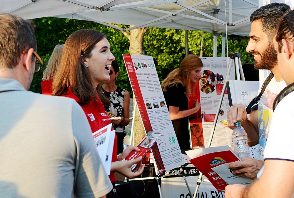 Annali Evling, a senior studying textile engineering, hands out information at the Info Tent during Entrepalooza on Thursday, Sept. 12th, 2019. Entrepalooza hosted a variety of different business that students could talk to and learn more about.