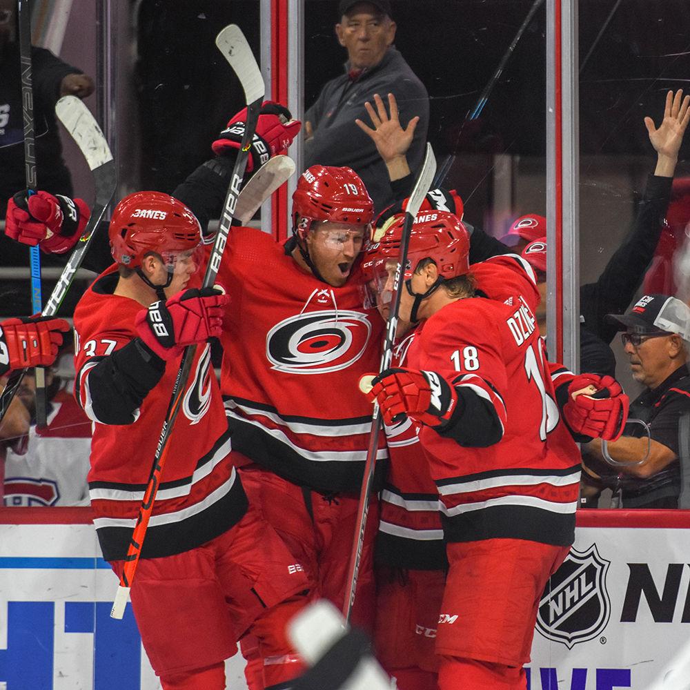 Carolina Hurricanes players Dougie Hamilton, Andrei Svechnikov and Ryan Dzingel celebrate a goal scored against the Montreal Canadiens on Thursday, Oct. 3, 2019 in PNC Arena. The Canes beat the Canadiens 4-3 after an overtime period and shootout.