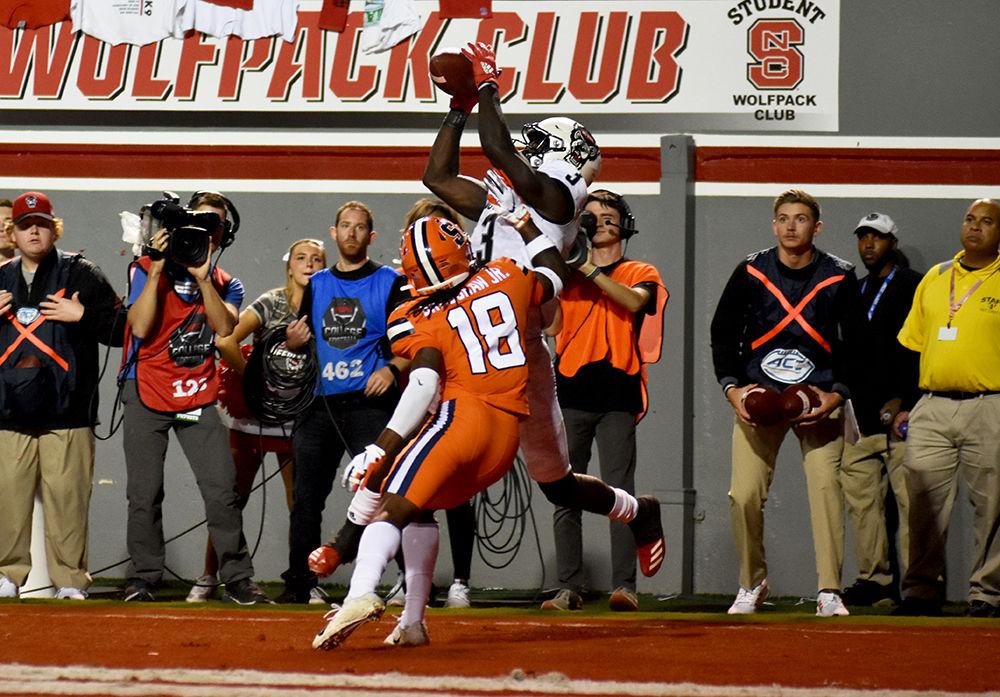 Junior wide receiver Emeka Emezie attempts to catch a ball against Syracuse on Thursday, Oct. 10, 2019 in Carter-Finley Stadium. Emezie received for 77 yards on five receptions in the 16-10 win over the Orange.
