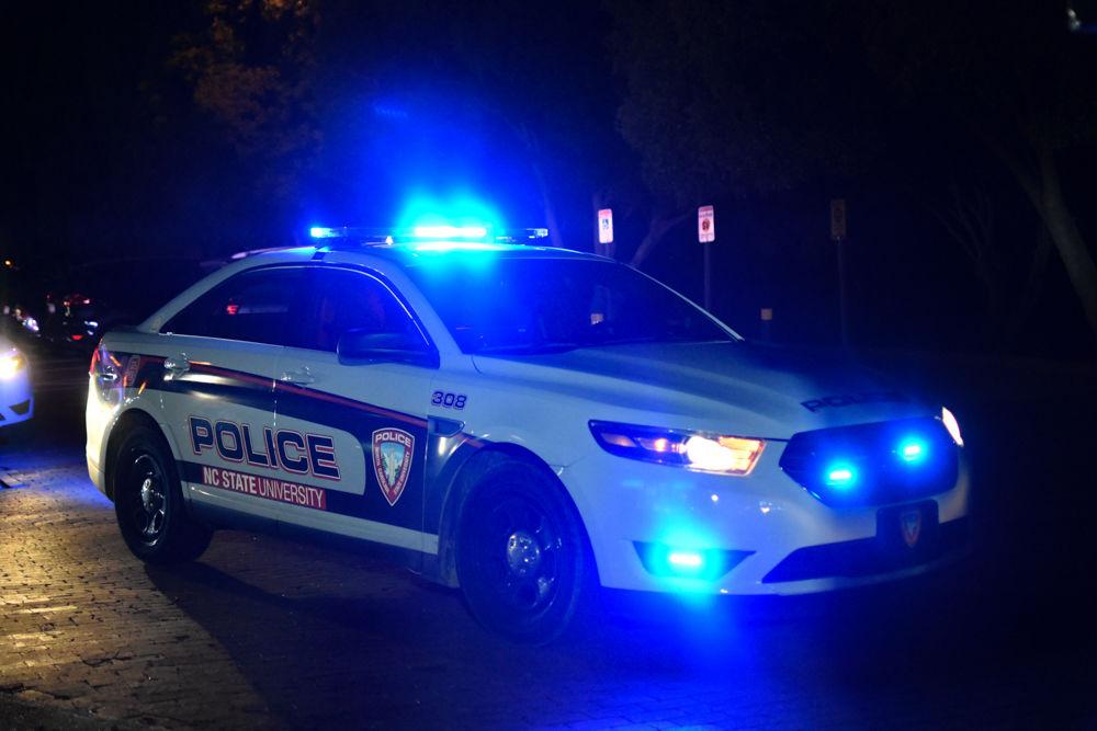 An NC State University Police car sits outside of Bowen Hall as first responders perform a medical assist on Saturday, April 27, 2019.