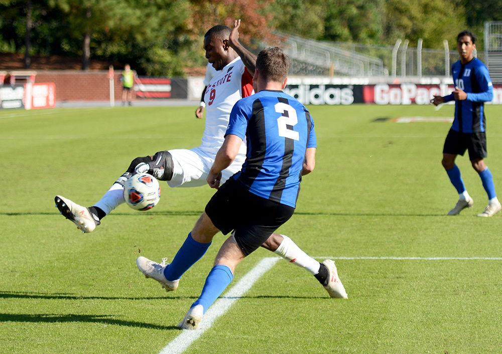 Sophomore forward, Kuda Muskwe blocks a shot taken by a Duke opponent in Dail Soccer Field on November 6, 2019. Muskwe had four shots, one shot on the goal, and one goal in the Wolfpack&#8217;s 2-1 victory over the Duke Blue Devils. The Wolfpack will advance to the second round of the ACC tournament.