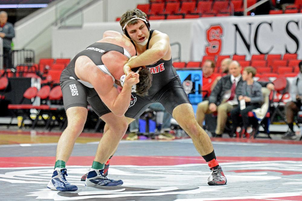 Colin Lawler, a freshman in the 285-pound weight class, wrestles Brown senior Ian Butterbrodt on Saturday, Jan. 12 at PNC Arena. Lawler lost his bout 4-0 but the Wolfpack ended up beating Brown 29-10.