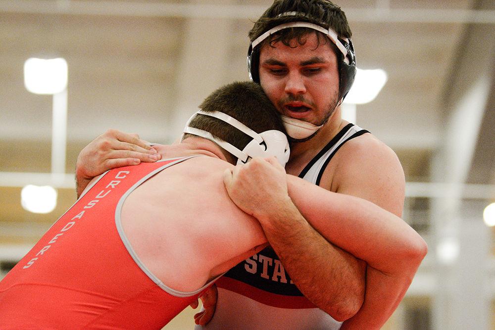 Colin Lawler, a sophomore, wrestles in the heavyweight weight class during the match against Belmont Abbey on Saturday, Nov. 16, 2019. He won the George Mason Patriot Open while he was in redshirt, going 4-0.