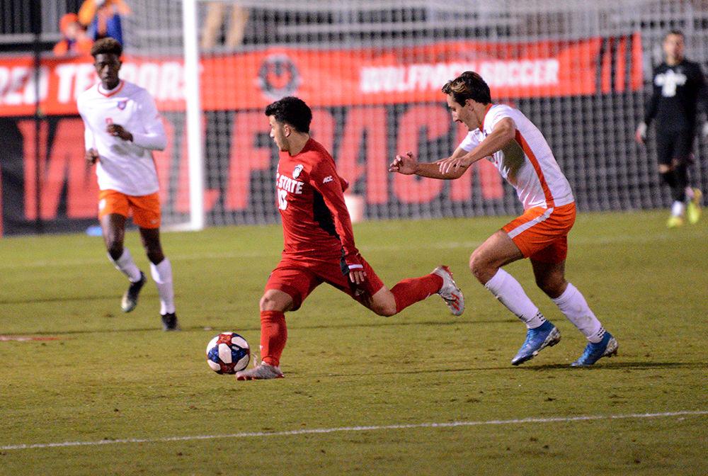 Junior midfielder David Loera looks to teammates for an open pass. Loera spent 90 minutes on the field during NC State's game against Clemson. The Wolfpack lost 0-3 against Clemson on Friday, Nov. 1, 2019 at Dail Soccer Field.