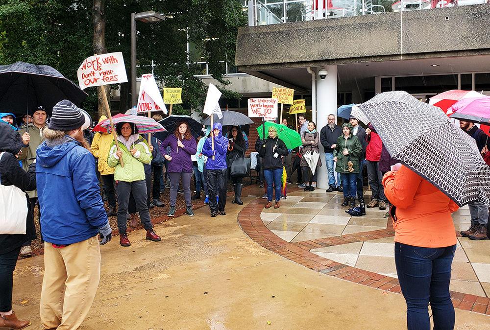 Graduate students rally against student fees in the Brickyard on Tuesday, Nov. 12, 2019.