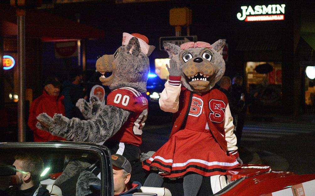 Mr. and Mrs. Wuff raise the crowd's spirits in the Red and White Week parade on Friday, Nov. 8, 2019. Red and White Week is a spirit week that celebrates NCSU's past and its bright future.