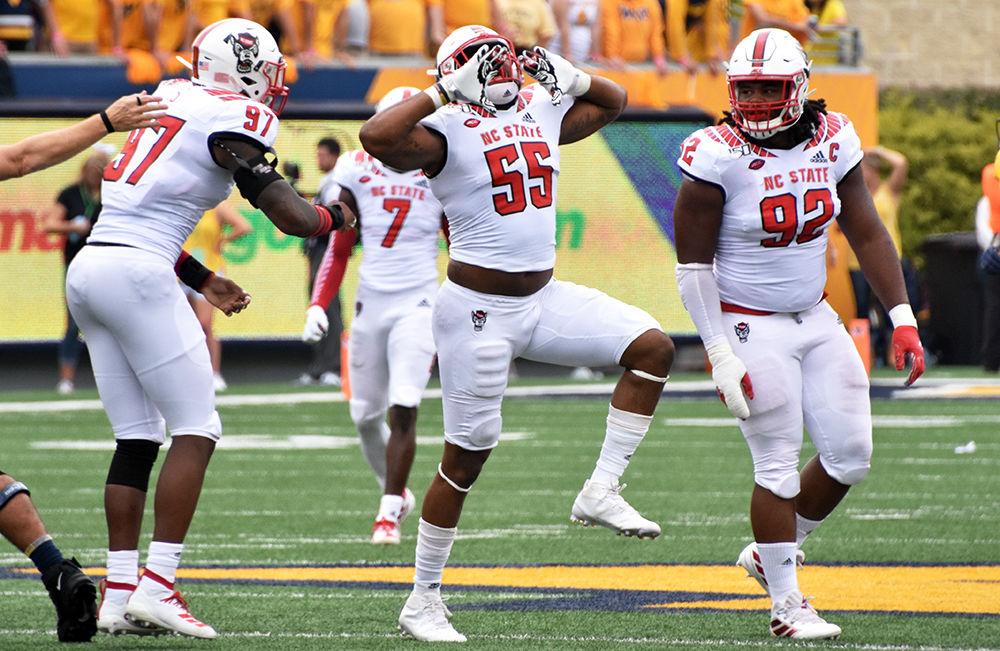 Redshirt graduate defensive end Deonte Holden celebrates a sack during the team's game against West Virginia on September 14, 2019 at Milan Puskar Stadium. The Wolfpack lost, 44-27.