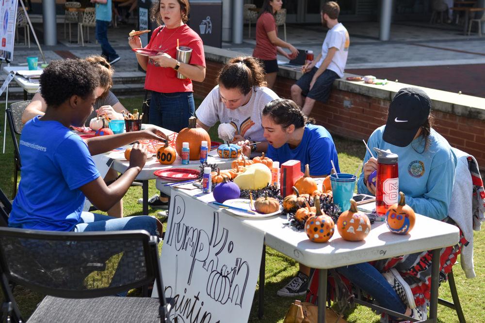 Participants cool off after the Water Walk by painting pumpkins at the Water Walk at Stafford Commons on Oct. 26, 2019. The Water Walk is an event where racers experience what it is like from a global perspective for the average women to transport clean water by walking two laps around the commons with a full bucket of water. Proceeds for this event go to support Wine to Water, an organization whose efforts go to bringing clean water to those in need.