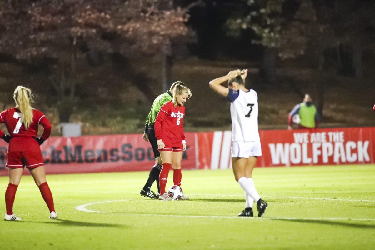 Redshirt sophomore defender Lulu Guttenbgerger lines up for a free kick against Navy. Guttenberger scored the first goal and assisted the second goal against Navy in the team's 3-0 win.