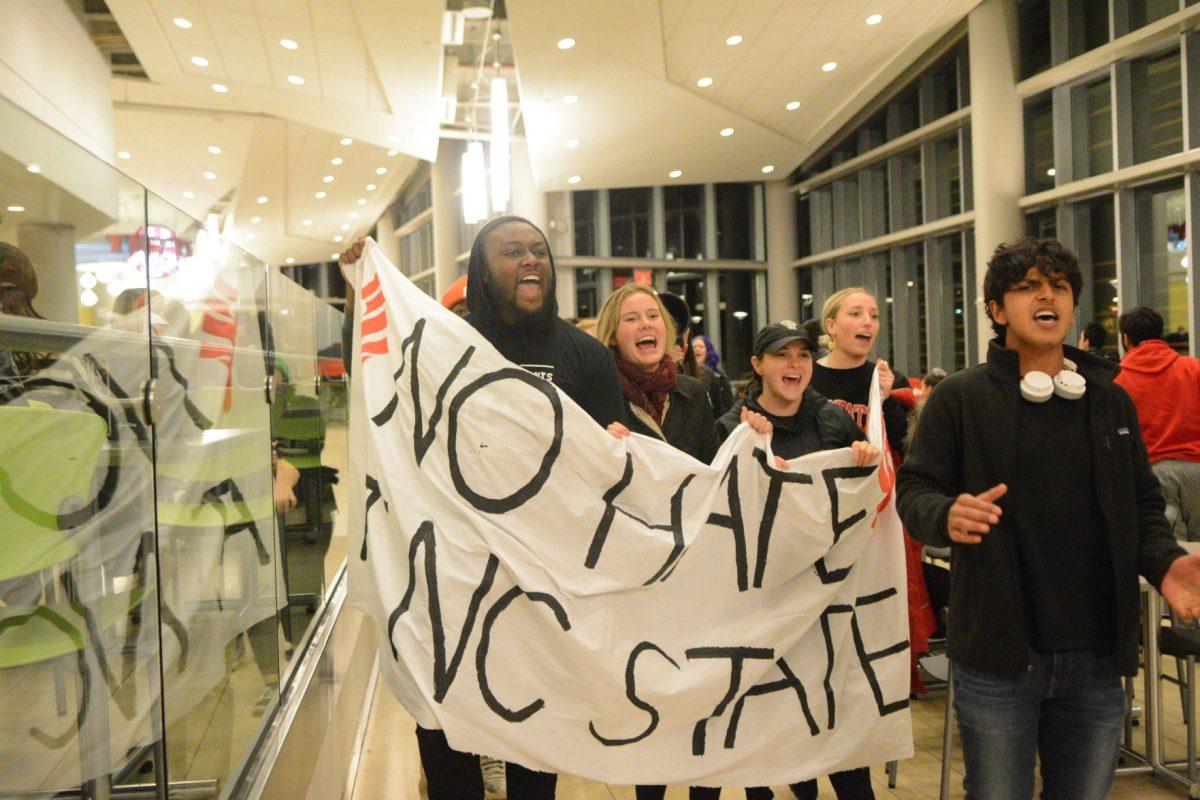 Christian Wade and Mikhail Reza lead the procession during the No Hate at NC State Protest on Wednesday, Nov. 13, 2019. The No Hate at NC State protest was protesting the Turning Point U.S.A. Culture War event.