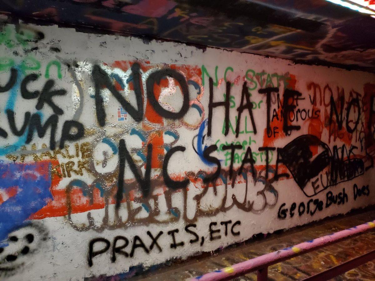 The words "No Hate NC State" are spray painted in the Free Expression Tunnel on Nov. 13, 2019, the same day as Turning Point USA's Culture War event featuring Lara Trump and Charlie Kirk.