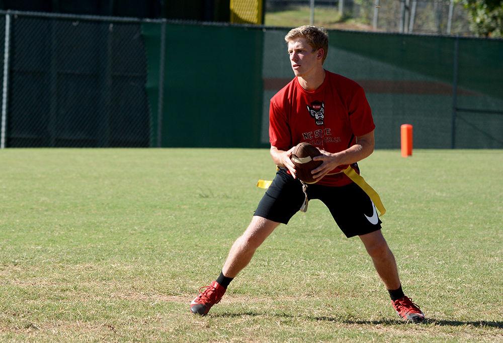 Second year studying animal science Cade Tuthill looks for an open pass during a scrimage at practice. NC State's club flag football team recently completed tryouts and has begun preparing for upcoming games.