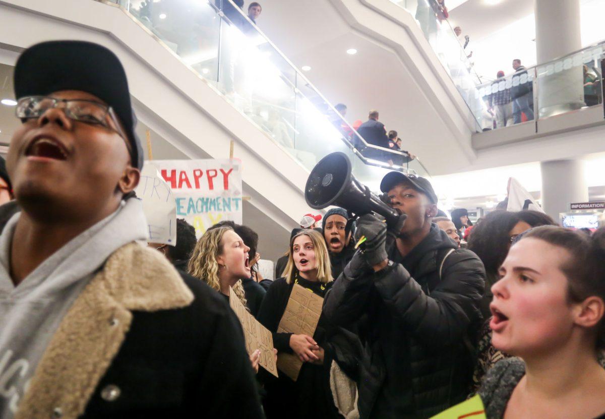 Preston Bowditch II, a junior studying Physiology and Neurobiology, uses a bullhorn to lead chants during the No Hate At NC State protest of a Turning Point event in Talley Student Center on Wednesday, Nov. 13, 2019. "I'm not not a leader here. I just came out because I'm a black man in America, so I face racism already. And I'm an ally, so I'm out here to support my friends who are gay. If you view Donald Trump's policies and campaign, he hates all of these marginalized people."