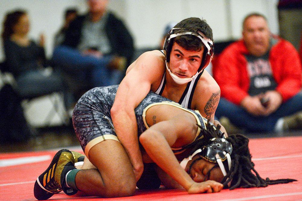 Tommy Cox, a Redshirt junior, wrestles in the 125 weight class during the match against UNC Pembroke on Saturday, Nov. 16, 2019. He went 14-11 in six open tournaments during the 2018-19 season.