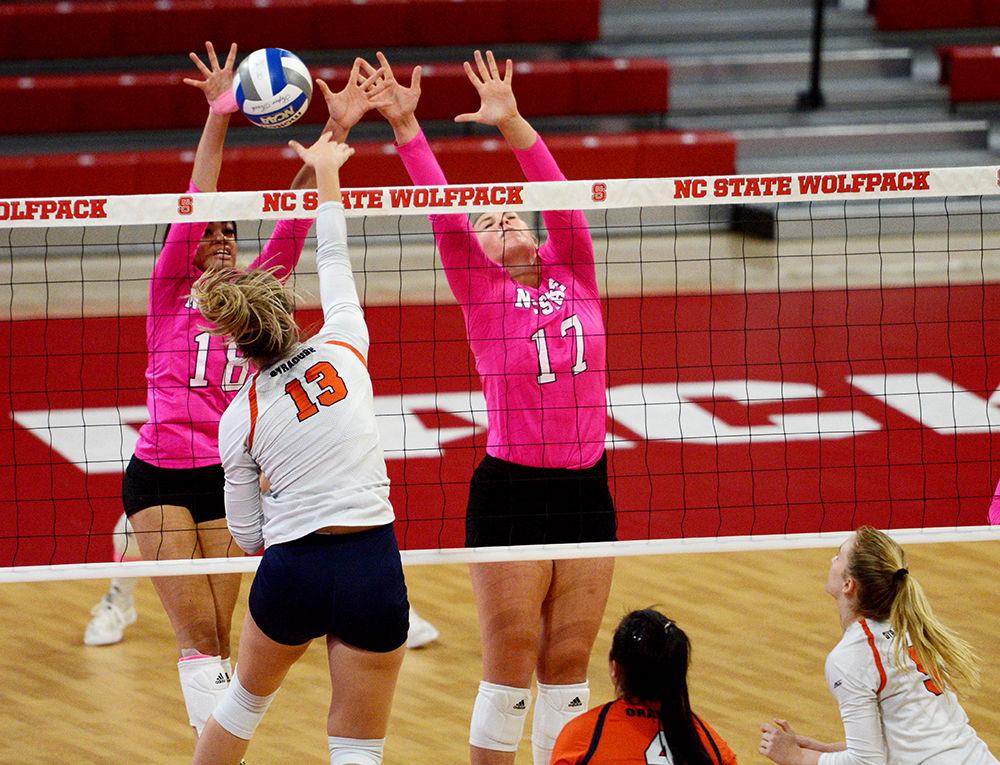 Redshirt junior middle blocker and right side, Jessica Kemp and redshirt freshman setter, Nina Sharpton go up for the block in Reynolds Coliseum on October 27. Kemp had ten kills and Sharpton had two kills, 40 assists, two block assists, and five digs in the Wolfpack&#8217;s 3-0 loss to Syracuse.