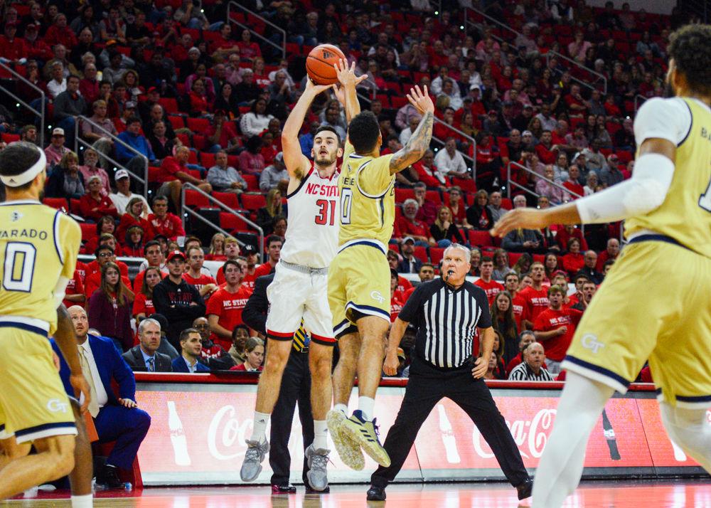 Graduate forward Pat Andree shoots a three-point shot in PNC Arena on November 5. Andree played 36 minutes with 12 points, eight rebounds, and one assist in the Wolfpack&#8217;s 82-81 overtime loss to Georgia Tech.
