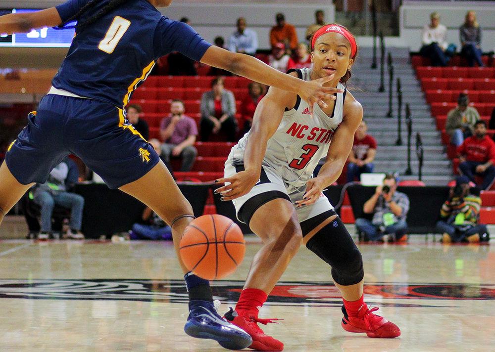 Junior guard Kai Crutchfield passes past the defense during the 80-44 win over North Carolina A&amp;T Wednesday, Nov. 6, 2019 in Reynolds Coliseum.