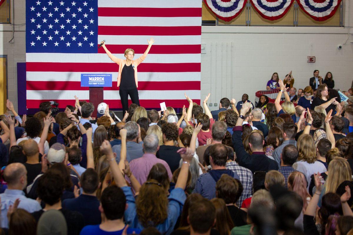 Senator Elizabeth Warren takes a pauses in her speech for applause on Thursday, Nov. 7 in Broughton High School. This was the first campaign rally for senator Warren in North Carolina this campaign season.