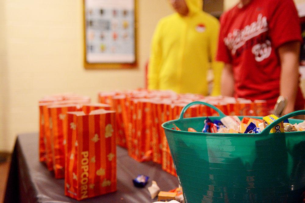 The UAB serves free popcorn and candy during Scream on the Green on Thursday, Oct. 31, 2019. Scream on the Green is an annual event hosted by the UAB that involves snacks, drinks, and a scary movie. This year's movie was "Scary Stories To Tell In The Dark."