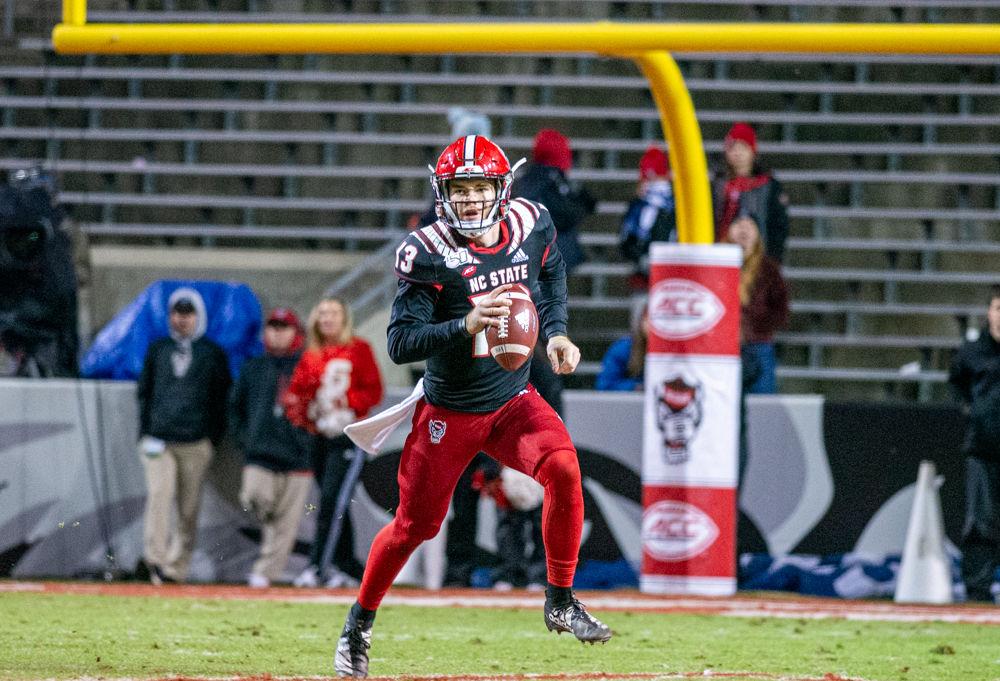 Redshirt freshman quarterback Devin Leary rushes versus Louisville on Saturday, Nov. 16, 2019 at Carter-Finley stadium. Leary threw for 243 yards and two touchdowns in the 34-20 loss.