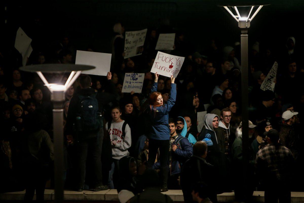 Brittany Gaustad, a graduate student studying Sociology, holds up a sign outside of Talley during the No Hate At NC State protest of a Turning Point event in Talley Student Center on Wednesday, Nov. 13, 2019. "I'm protesting the fact that NC State is allowing Lara Trump to come and preach hate," she said. " Donald Trump preaches hate against every marginalized group you can think of."