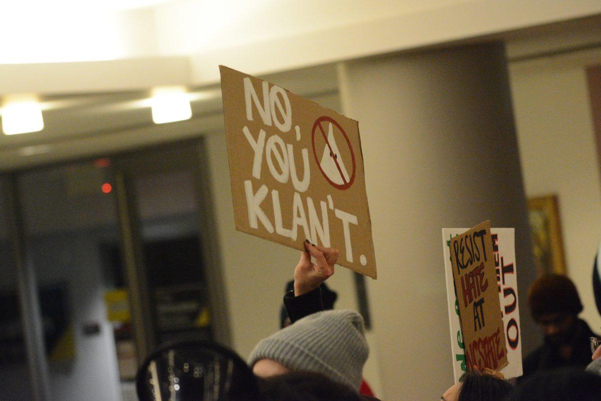 Signs are raised in protest of any and all racism on campus during the No Hate at NC State Protest on Wednesday, Nov. 13, 2019. The No Hate at NC State protest was protesting the Turning Point U.S.A. Culture War event.