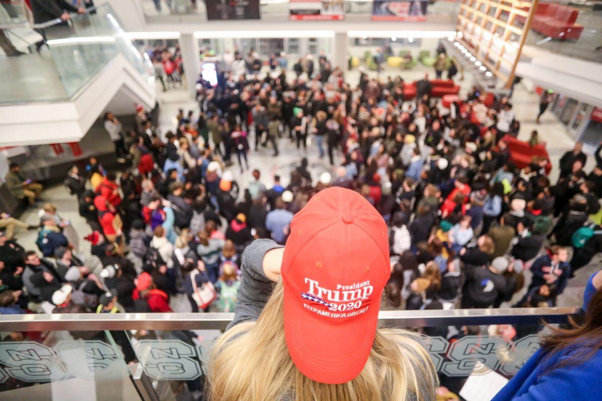 McKenna Martin, a sophomore studying high school science education, looks down on the No Hate At NC State protest of the Turning Point "Culture Wars" event in Talley Student Center on Wednesday, Nov. 13, 2019. Martin had a ticket, but wasn't able to get into the full event. "We're all here because we believe in something, we just believe in different things," she said about the protesters. "I don't like being called a racist. And it's like there's a double standard, where they can call us racists, but they're assuming things about all of us."