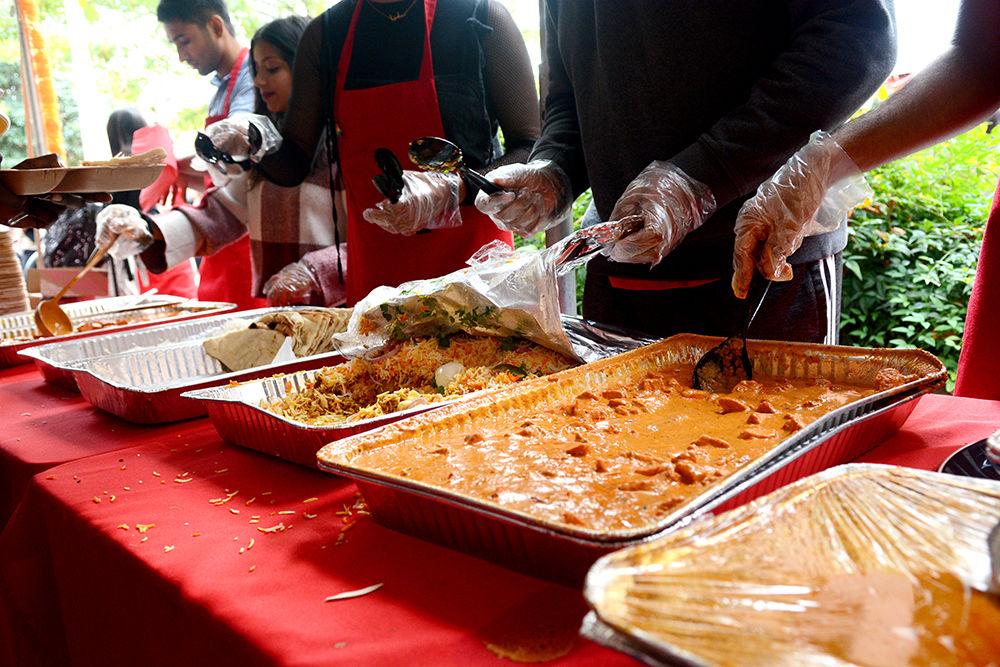 Students serve naan bread, biriyani, and chicken tikka masala in celebration of Diwali on Tuesday, October 29, 2019, at the Poole College of Management. Diwali is a Hindu festival of lights, and marks the beginning of the fiscal year in India.